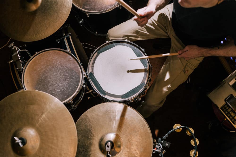 Overhead shot of drummer playing drum kit