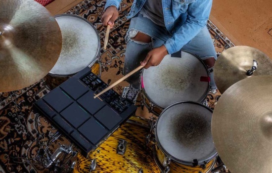 Drummer with Alesis Strike Multipad and drums