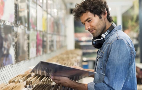 Man browsing for vinyl in a record store