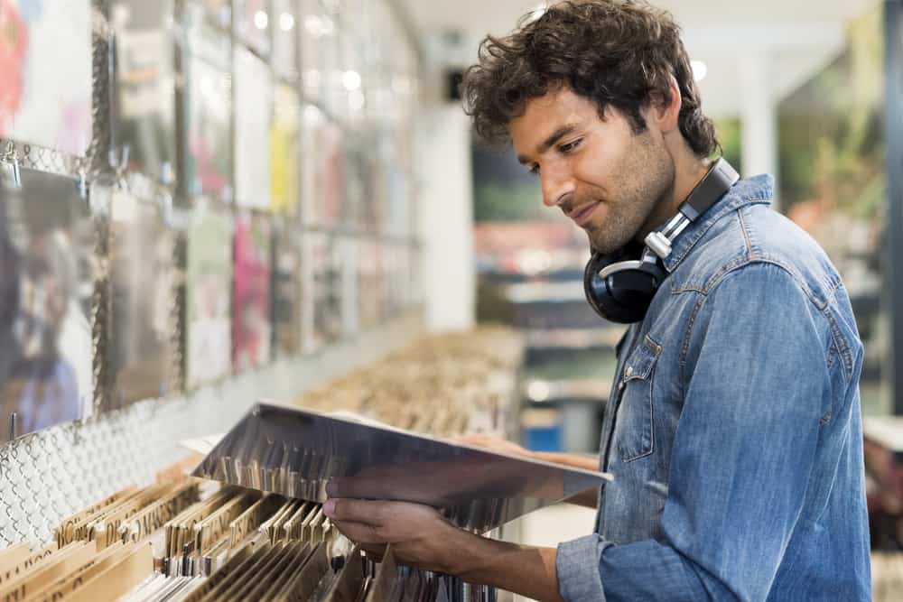 Man browsing for vinyl in a record store