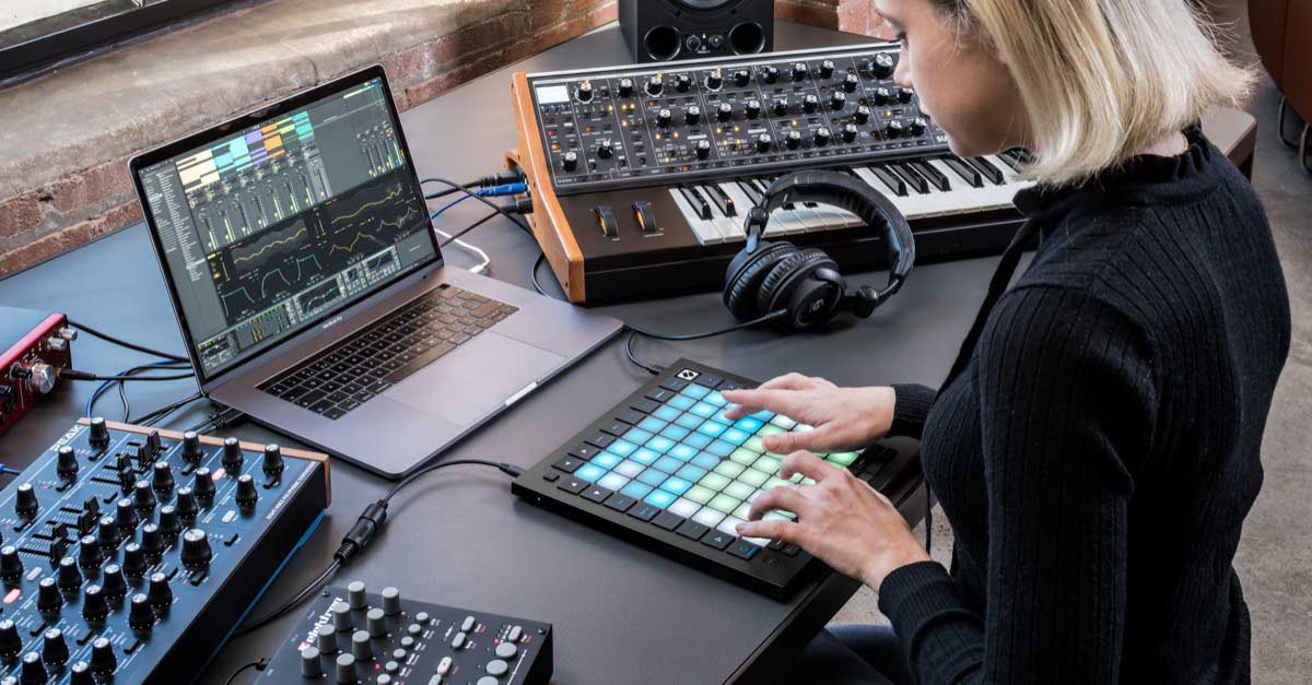 Woman using one of the best midi controllers, the Novation Launchpad Pro