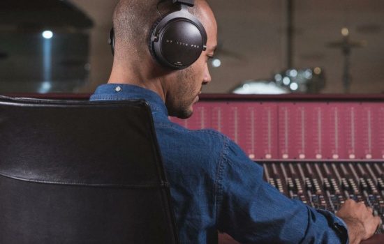 Recording Engineer with Beyerdynamic headphones in studio