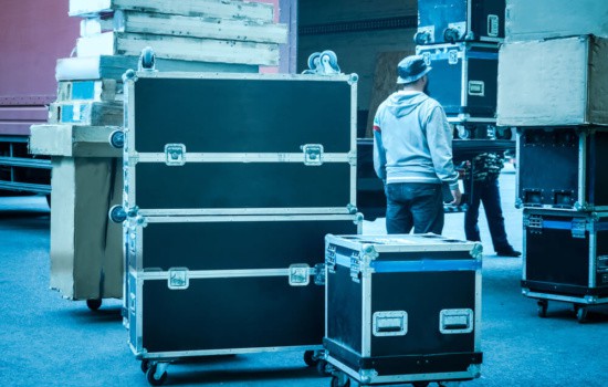 Concert backstage with touring crew and flight cases