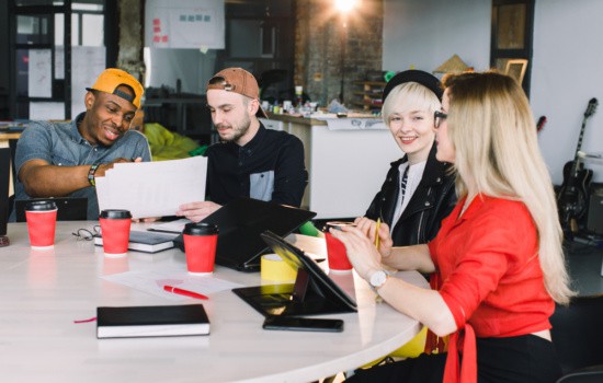Four young students studying at college