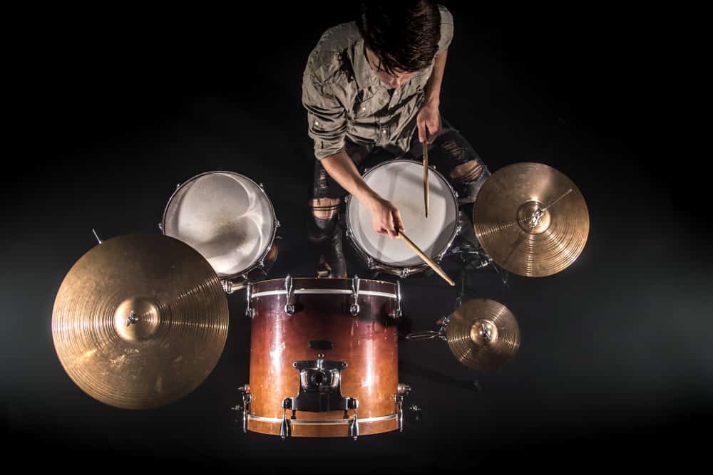 Male drummer with drum kit shot from overhead