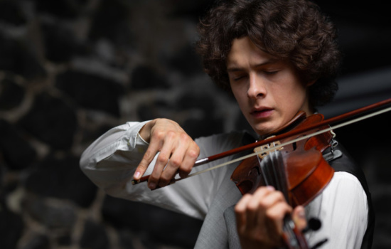 Concertmaster playing his violin