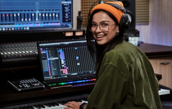 Female Sound Designer in production studio