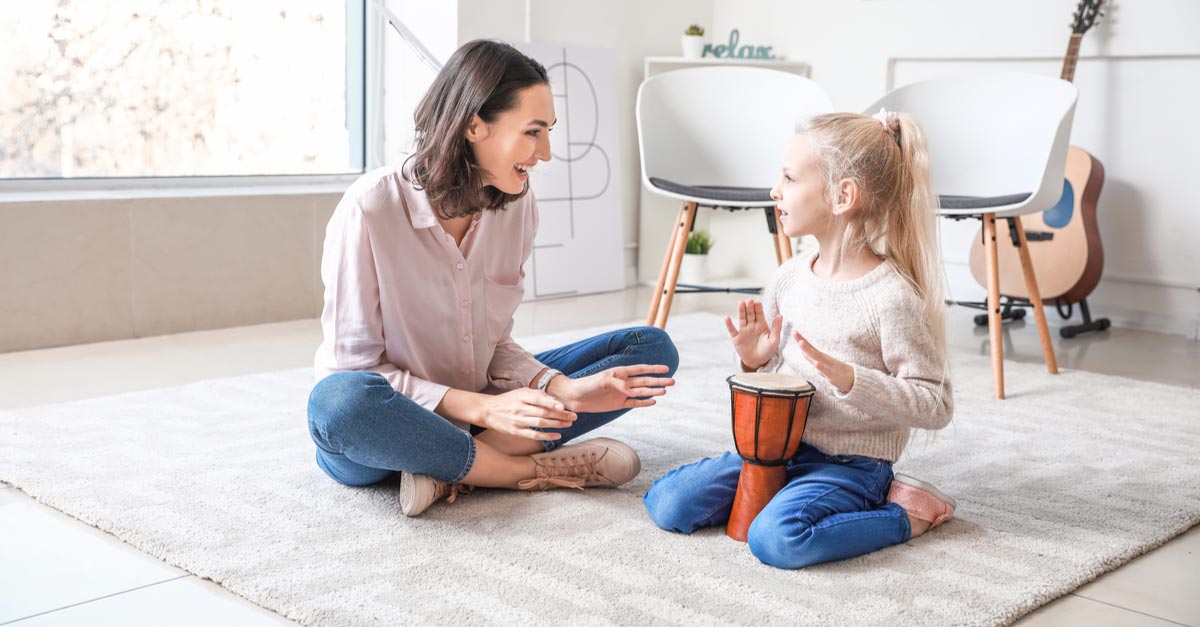 Female Music Therapist with young female patient