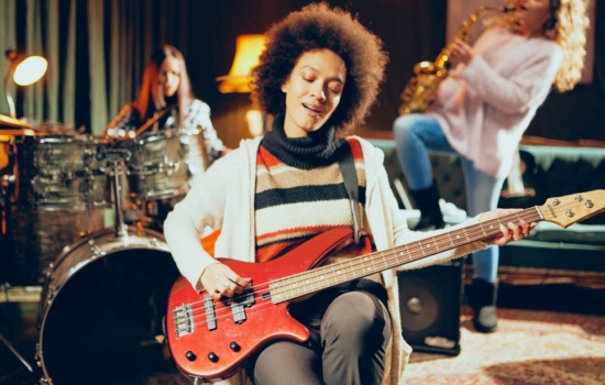 how to write good lyrics for a song Young female Bassist with her band
